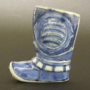 A Very Rare Ming Blue and White Kraakware Porcelain Model of a Boot, Wanli Period 1573-1620. Booth Sides of the Boot Have What Appears to be Some Type of Armour, the Lower Upright Area Before the Foot is Gathered in Possibly Indicating Some Sort of Covering Over the Boot. Decorated in Typical Kraak Designs.SOLD

Condition
The top rim, and toe of the boot with numerous filled chips, small glaze losses filled.
Size
Height : 9.6 cm (4 inches).
Provenance
R & G McPherson Antiques, stock number 16338. The John Drew Collection of Chinese and Japanese Ceramics, collection number 429.
Stock number
23335