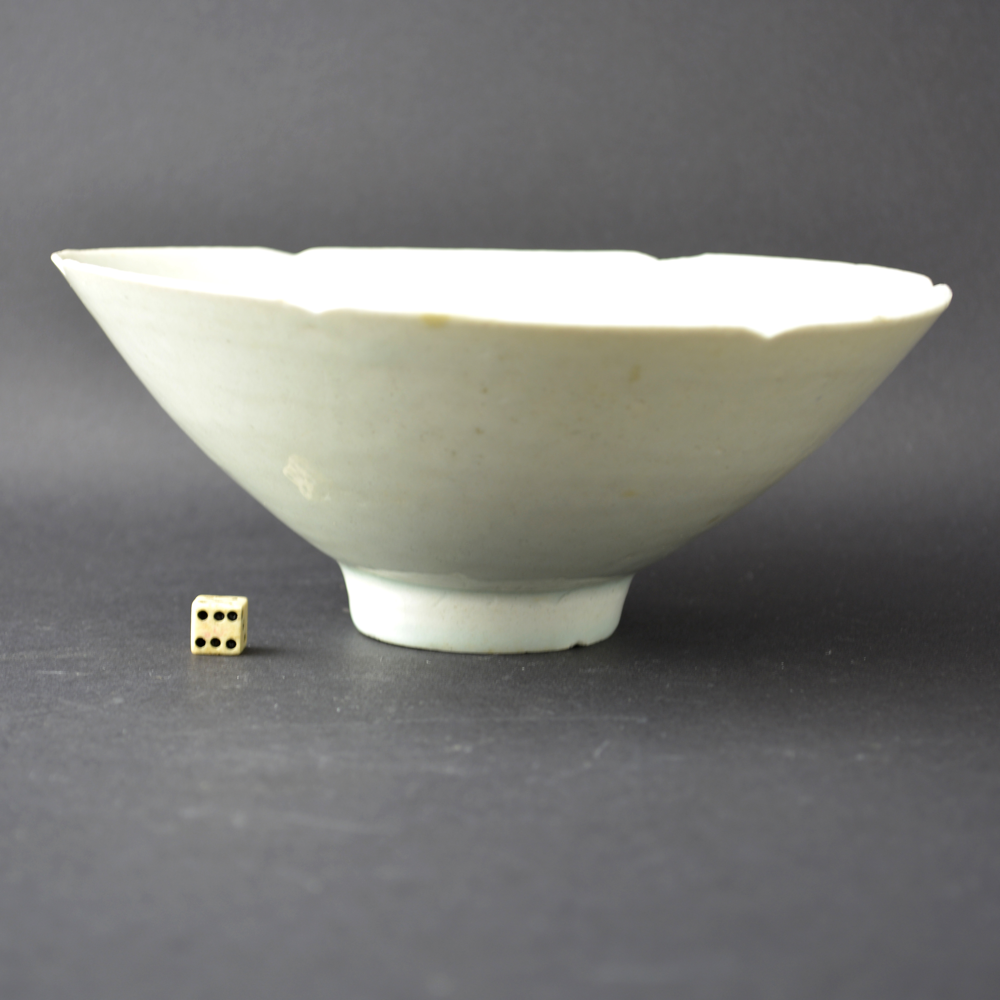 A fine Qingbai 'peony-head' carved conical bowl, Southern Song