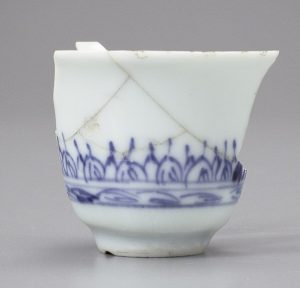 Wine cup, Jingdezhen, China, 1600–1640. Hard-paste porcelain. H. 1 1/2". (Courtesy, Virginia Department of Historic Resources; photo, Robert Hunter.) More than a dozen of these diminutive cups with ï¬‚ame-frieze decoration have been reported from early-seventeenth-century Virginia archaeological sites. These ï¬ne cups were once thought to be Imperial ware, reserved for use by the Chinese elite. Now they are recognized as status vessels made for export. They have been found on a number of Dutch shipwrecks (such as the Witte Leeuw, 1613, and the Hatcher, 1643) and terrestrial sites dating to the ï¬rst half of the seventeenth century. This example was recovered from the Walter Aston Site, Charles City County, Virginia, in a 1630–1650 context.