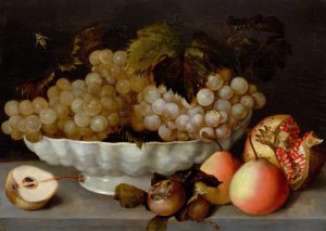 Fede Galizia (1578 Milan 1630), Still life of fruits with grapes in a white ceramic bowl, with pomegranate and pears on a stone plinth.