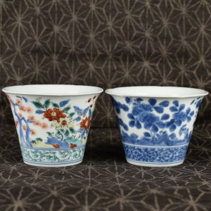 A Kakiemon Blue and White Porcelain Beaker from Margret Duchess of Portland 1715 – 1785. Shown with a polychrome example.