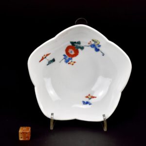 A 17th Century Japanese Kakiemon Porcelain Bowl. The shallow bellflower, called Kikyō, form has everted ‘petals’, it is painted using Kakiemon enamels with Chrysanthemum, the national flower of Japan.This understated subtle asymmetrical design is typically Japanese and is at its best on Kakiemon wares. The use of space shows off the pure white Nigoshide (milky white) porcelain to its full effect. Kakiemon decoration is usually of high quality, often delicate and with well-balanced asymmetric designs. These designs were normally quite sparse emphasizing the fine white porcelain known in Japan as Nigoshide (milky white porcelain). A Pair of Kakiemon Bowls of the Same Shape and Design, from Burghley House are illustrated in the catalogue : The Burghley Porcelains, An Exhibition from The Burghley House Collection and Based on the 1688 Inventory and 1690 Devonshire Schedule. See below the Photograph Gallery for one of the Burghley bowls and other references. The opaque white milky Nigoshide porcelain was used on the finest pieces, it appears that it was reserved for fine quality enamelled decoration and the secret of its production was guarded well. Kakiemon porcelain was decorated with a great variety of imaginative designs which include elements such many of which are well known in the West. Elements of these designs acquired European names early on. For example `banded hedge`, these are actually a brushwood fences, `flying squirrel`, these are tree shrews and the`Quail and Millet` design. The `Three Friends of Winter` were also a very popular group of designs, other subject taken from nature include flowers (especially the chrysanthemum, the national flower of Japan) as well as birds and rock-work. Figural subjects such as the `Hob in the Well` were also popular. This design illustrates a Chinese folk tale where a sage saves his friend who has fallen into a large fish-bowl by throwing stones at it, breaking open the pot. Banded-Hedges were a formal device within Japanese traditional gardens, they were often incorporated in designs, includes `The Three Friends of Winter` (Pine, Bamboo and Prunus). These three plants signify perseverance, as neither the pine nor the bamboo shed their leaves in winter and the plumb (Prunus) flowers at the very end of the winter, heralding the arrival of spring. See below for more photographs and references. SOLD Condition In perfect condition, some minute firing spects to the glaze. Size Diameter 12.6 cm (4 3/4 inches) Provenance An English private collection formed in the 1960s. Stock number 26109 References The Burghley Porcelains, An Exhibition from The Burghley House Collection and Based on the 1688 Inventory and 1690 Devonshire Schedule (Japan Society, New York, 1986. ISBN 0-913304-23-9). Page 249, item 104.