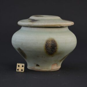  Yuan Longquan Celadon ware iron-spot celadon jar and cover, Yuan Dynasty 1279-1368. This unusual small Yuan (1279-1368) jar and cover with its celadon glaze comes from the Longquan Kilns and dates to the end of the 13th or early 14th Century. The glaze is partly degraded due to the piece being from a shipwreck.SOLD Condition There is no damage, however the glaze is of a rather matte appearance due to being immersed in seawater. Size Diameter : 8 1.2 cm (3 1/4 inches) Provenance Robert McPherson Antiques (stock number 14435). Mrs Helen Espir. R and G McPherson Antiques. A Private English Collection of Early Chinese Ceramics. Stock number 24638 References For a similar Yuan celadon jar with iron spot decoration (lacking its cover) see : Chinese Celadons And Other Related Wares In Southeast Asia (Southeast Asian Ceramic Society, Singapore. Arts Orientalis, Singapore.1979). Pages 194-195 plate 121.