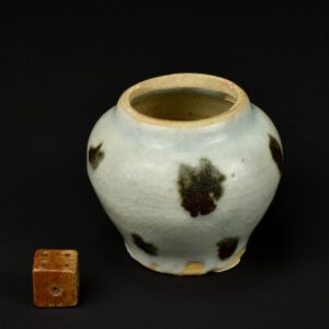 A Miniature Yuan Iron-Spot Jar of Guan Form, Jingdezhen Kilns, Yuan Dynasty 1279-1368. It would originally have had a cover, either plain, or in the form of a lotus leaf. This small jar is a guan, a shape used during the Yuan period. Small guan can also be found with iron-spot decorated in celadon (see below for an example we sold some years ago). The form was of course used primarily on a larger scale, for example Yuan blue and white porcelain. This Qingbai jar, was sold by Bluett in London, and has their label on the base, with the number 413, perhaps a number from an exhibition