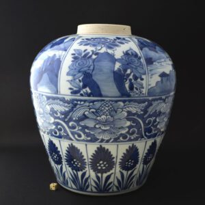 A large Kangxi Blue and White porcelain jar, probably late in the period c.1700-1720. The heavily potted jar is decorated with panels of flowering peony among rocks alternated with landscapes to the shoulder. The central register is of scrolling peony, below is a border of stylised ‘aster’ pattern. The flat base is unglazed.SOLD Condition In perfect condition. Size Height : 27 cm (10 1/2 inches) Provenance N/A Stock number 24629
