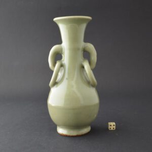 A fine small Yuan celadon ware vase, late 13th to mid 14th century, Longquan kilns, Zhejiang Province. Based on a Chinese bronze form this small vase with a rich thick green celadon glaze has a pair of handles with loops fired into position. Related vase were recovered from the Sinan Wreck of 1323.SOLD Condition In excellent condition, there is a chip to the inside of the footrim Size Height : 16 cm (6 1/3 inches). Provenance A European Collection, Acquired Between 1965 - 1985. Stock number 103 References Related pieces were recovered from the Sinan Wreck of 1323. See : Special Exhibition of Cultural Relics Found off Sinan Coast, National Museum of Korea 1977, Samhwa Publishing Co, Seoul, Korea, plate 311.