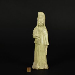 A Sui or Early Tang Straw Glazed Pottery Figure of a Standing AttendantSui Dynasty or Early Tang 7th Century A Sui or Early Tang Pottery Figure of an Attendant, North China, 7th century. This elegant Mingqi pottery figure has a cowl over his head, this is tied from behind. The moulding is shallow but very finely delineated, the greenish straw-coloured glaze is thick and finely crazed. The rough unglazed interior of this figure exhibits extensive construction marks including luting-lines with excessive slip. To read more about Mingqi pottery look below the photograph gallery. SOLD Condition In very good condition, the glaze is finely crazed, minor wear. Size Height 20.5 cm (8 inches). Provenance N/A Stock number 25755
