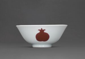 A FINE PUCE-ENAMELLED 'SANDUO' BOWLYONGZHENG SIX-CHARACTER MARK IN UNDERGLAZE BLUE WITHIN A DOUBLE CIRCLE AND OF THE PERIOD (1723-1735)