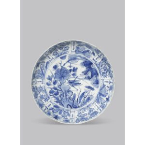 Fine Chinese Works of Art, Paintings & Calligraphy - 22 May 2018 LOT 179 A CHINESE BLUE AND WHITE EGRET-MARKED KRAAK 'CRICKET' DISH WANLI 1573-1620 Finely painted with a... Estimate: £2,000 - £3,000 Sold for £9,500 + Buyers Premium A CHINESE BLUE AND WHITE EGRET-MARKED KRAAK 'CRICKET' DISH WANLI 1573-1620 Finely painted with a cricket on a rock and with flower sprays, the moulded bracket-lobed rim with eight panels of various blossoms and cicadas, the reverse with eight panels of fruit and cicadas, the base with an egret mark and a circular label for Bluett & Sons, London, 19.7cm. Provenance: formerly the property of a titled English collector. Cf. Christie's New York, 16th March 2015, lot 3502, and Christie's Amsterdam, 20th May 2008, lot 9 for other egret-marked Kraak dishes. The egret mark appears exclusively on Wanli Kraak pieces of high quality, fine painting and moulded designs, was used at one particular kiln. There are only about 45 known examples recorded worldwide.