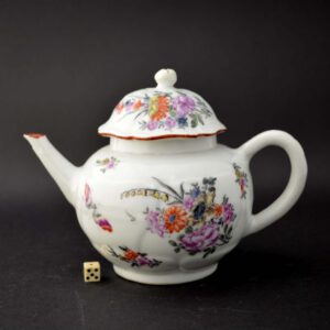 A London decorated Chinese export porcelain teapot and cover c.1750-1760, Enamelled in London between c.1755-1765. The lotus flower shaped body and cover Chinese Export Porcelain was painted in London, possibly by James Giles’s studio, with a Large sprig of English flowers, and further scattered flowers as well as a butterfly.SOLD Condition There is a long thin flake type chip under the spout. Size Height : 12.3 cm (4 3/4 inches). Provenance Sotheby's 12th November 1996, lot 461. The Helen Espir Collection of European Chinese Porcelain. Stock number 24723 References Exhibited and published : The Early James Giles and his Contemporary London Decorators (Stephen Hanscombe, Stockspring Antiques, 2008. ISBN 095501592-8) item number 69.