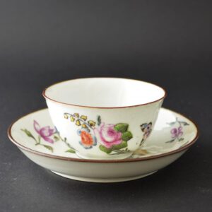 A London decorated Chinese Export Porcelain teabowl and saucer, soft-paste porcelain with a moulded design c.1750-1760, Enamelled in London between c.1755-1765. The plain Chinese Export Porcelain was painted in London, probably not by James Giles workshop but another workshop in London. with a Large Sprig of English Flowers, and Further Scattered Flowers.SOLD Condition In excellent condition, very minor rubbing to the center of the saucer. Size Diameter : 11.5 cm (4 1/2 inches) Provenance The Godden Collection of English-Decorated Chinese Porcelain. The great ceramic historian Mr. Geoffrey Godden says of his own collection "As I turn eighty-five and with my Biro fast running low, it seems time to pass on the smallest, the most select and probably the most interesting of my past collections-the mid-eighteenth century Chinese porcelains decorated in England for resale on the home market. The smallest of my collections because it represents a very rare class, produced within that historically-important period 1740-1760". Stock number 24778 References Exhibited : The Early James Giles and his Contemporary London Decorators (Stephen Hanscombe, Stockspring Antiques. 2008)