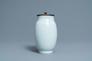 A Chinese monochrome white vase with an incised design of birds, Transitional period.