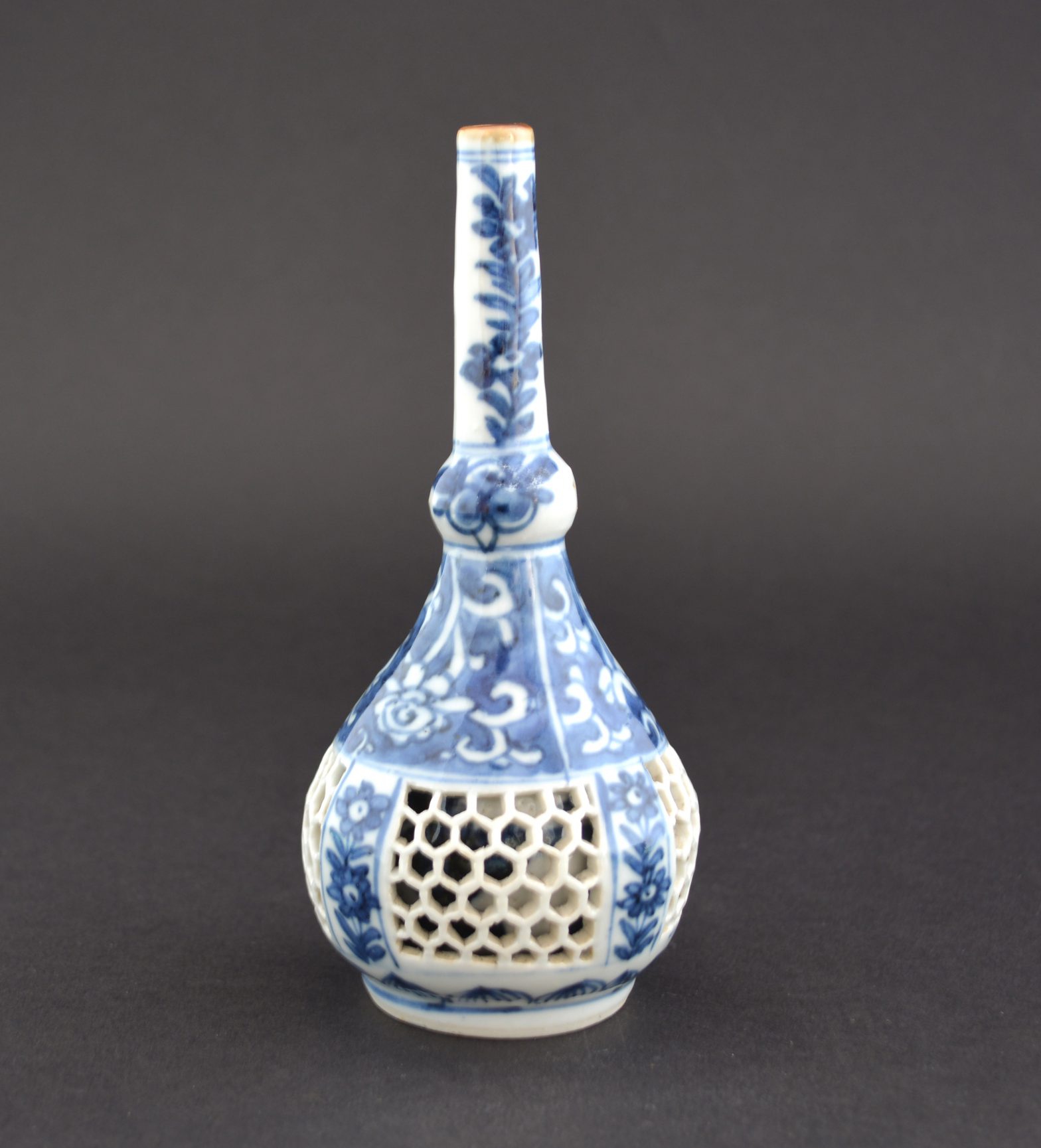 An Usual Kangxi Blue and White Linglong Rosewater Sprinkler c.1690-1720.SOLD Condition In very good condition, a tiny piece of the reticulation is repaired (see the photograph of it prior to repair). Size Height : 15.1 cm (6 inches) Provenance N/A Stock number 24368
