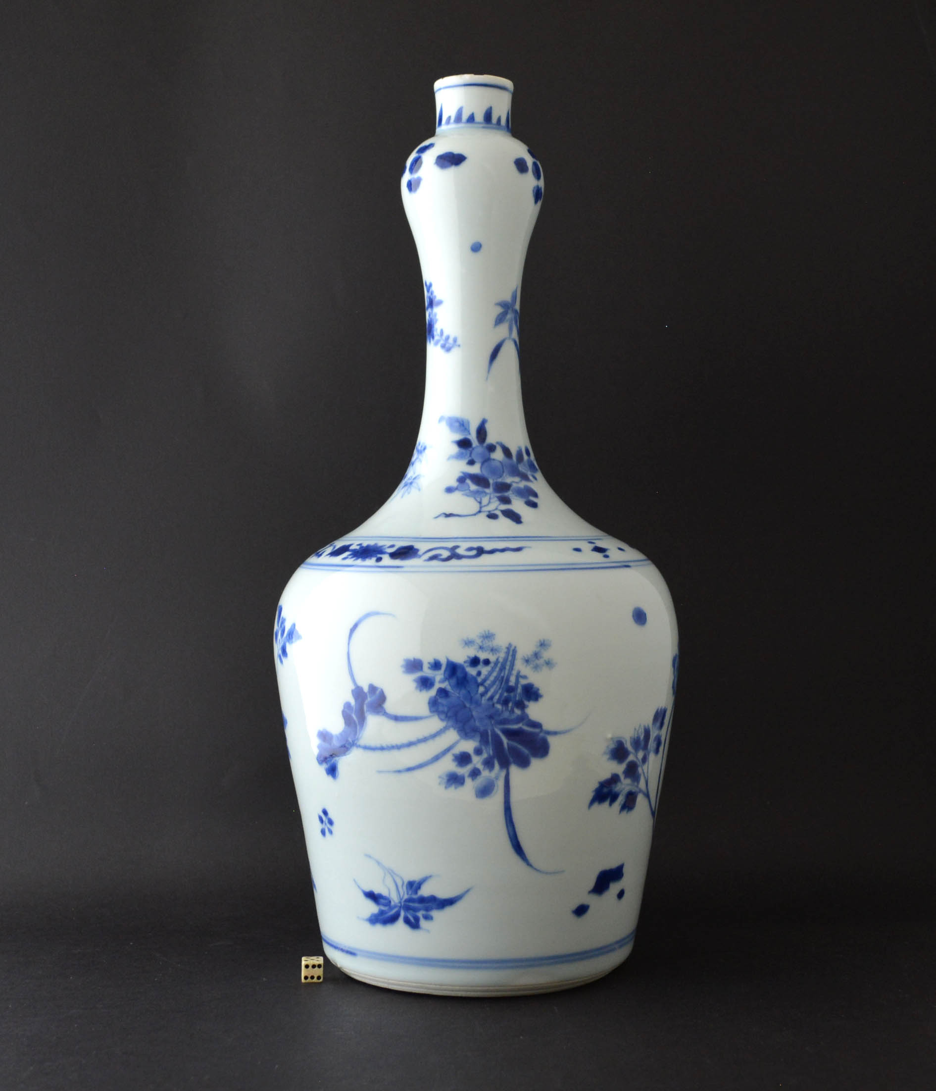 A Transitional Blue and White porcelain vase, late Ming or early Qing, Chongzhen or Shunzhi Period c.1640-1650. The body decorated with `Floating Flowers`, lotus, tree peony Paeonia Suffruicosa, orchid, bamboo and other Plants.SOLD Condition There are two small rim chips : a slender shallow flake type chip to the inner rim c.9 x 2mm, a very shallow chip, mostly glaze chip, to the outer edge c.5 x 4 mm. minor fritting. The base is not totally even so if it is pushed it moves a bit. Size Height : 39 cm (15 1/4 inches) Provenance N/A Stock number 24763 References For a similar late Ming or early Qing porcelain vase see : L`Odyssee De La Porcelaine Chinoise (Editions de la Reunion des Musees Nationaux,2003) Page 121 Item 53. For Transitional Porcelain vases of this type see : Fine and Important Late Ming and Transitional Porcelain, Recently Recovered From The South China Sea, The Property of Michael Hatcher (Christie`s Amsterdam, March 1984) Lot 181. For a further Blue and White Transitional Porcelain vases of this form see our `Sold Items` number 18943, 21372 and 23901.