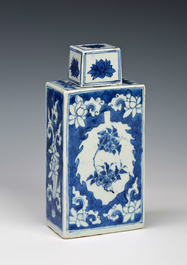 A pair of Chinese rectangular canisters and covers, circa 1640.The canisters are decorated with leaf-shaped reserves of blossom on a cracked ice ground, surrounded by lotus sprays in reverse technique. The white ground covers have a lotus bloom on each facet, 21.5cm. They are recorded in the 1690 Devonshire Schedule, an inventory recording an enormous bequest from Elizabeth, Countess of Devonshire (1619-1689), to her daughter Anne, Countess of Exeter (1649-1703). Under the heading ‘Large plain China’ are listed: ‘A pair of blue and white flatt square Bottles with hollow fflatt cover to them.’ REFERENCE: CER0340