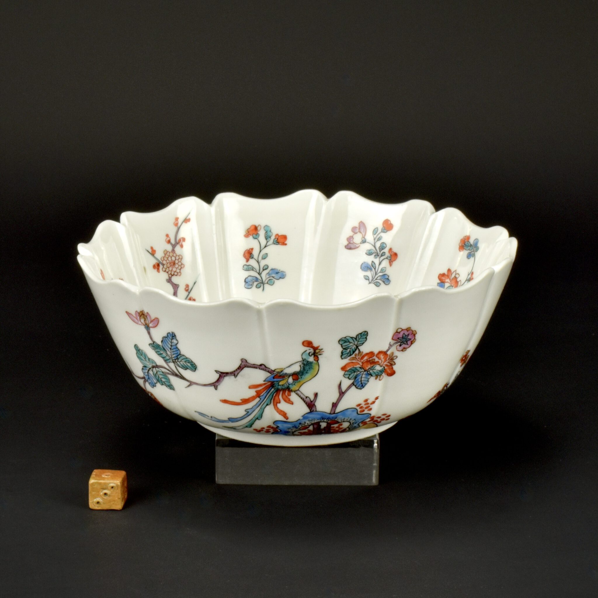 A Rare Meissen Böttger Porcelain Bowl with Dutch Kakiemon Decoration, the porcelain dates to c.1715 – 1720, the Kakiemon style decoration was added in the Netherlands c.1720 -1730. This indented lobbed Meissen Böttger porcelain bowl is bowl was made without decoration. The shape is based on Japanese porcelain, the decoration is in the Japanese Kakiemon style, so the bowl would have been seen as being Japanese by many people at the time. The painting style is quite close to the Japanese original, however the enamels have pink puce colour that is more akin to Chinese Famille Rose enamel of the period. There is a matching bowl in the Gardiner Museum in Toronto, see below and References.See Below For More Photographs and Information. SOLD Condition A small flake chip to the outside rim, minor losses to enamels. Size Diameter 17.2 cm (6.8 inches). Depth 7.2 cm (2.86 inches). Provenance N/A Stock number 26055 References A Meissen Böttger Porcelain Bowl with Dutch Kakiemon Decoration almost identical to the present example is in the Gardiner Museum, Toronto. It is Illustrated in Dragons, Tigers and Bamboo : Japanese Porcelain and Its Impact in Europe (Oliver Impey, Christiaan Jörg, Charles Mason, Greystone Books, Canada. 2012. ISBN 978-1553654346)