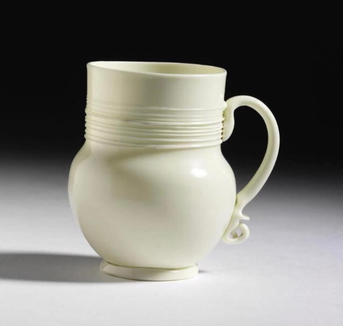 3) Glass Mug, England (probably London), 1680-1700. Imitating imported Blanc-de-Chine porcelain, and similar to the white stoneware mugs made by John Dwight at Fulham: a pair in the Schreiber Collection have mounts dated 1682.